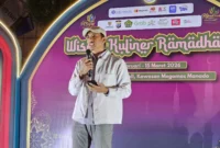 Analis Yunior/Asisten Manajer Fungsi Pelaksana Pengembangan UMKM KPw BI Sulut, Heriyanto, saat memberikan sambutan mewakili Kepala BI Sulut Joko Supratikto terkait penguatan ekonomi syariah pada penutupan Wisata Kuliner Ramadhan 2026 di Megamas Manado. Foto Istimewa