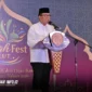 Kepala Dinas Perkebunan Sulawesi Utara, Darwin Muskin, saat membacakan sambutan Gubernur Yulius Selvanus pada puncak acara Hijrah Sulut Fest 2026 di Atrium Megamall Manado, Sabtu (28/2/2026).Foto : Jurnalis BI
