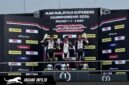 Dua pebalap muda Astra Honda saat merayakan kemenangan di podium Sepang International Circuit, Malaysia.